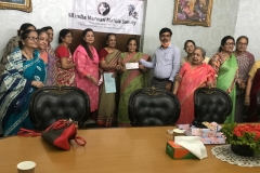 All-India-Marwari-Mahila-Samity-members-presenting-a-donation-cheque-to-a-representative-of-Asha-Bhavan-centre-Uluberia-home-for-differently-abled-women-and-Children